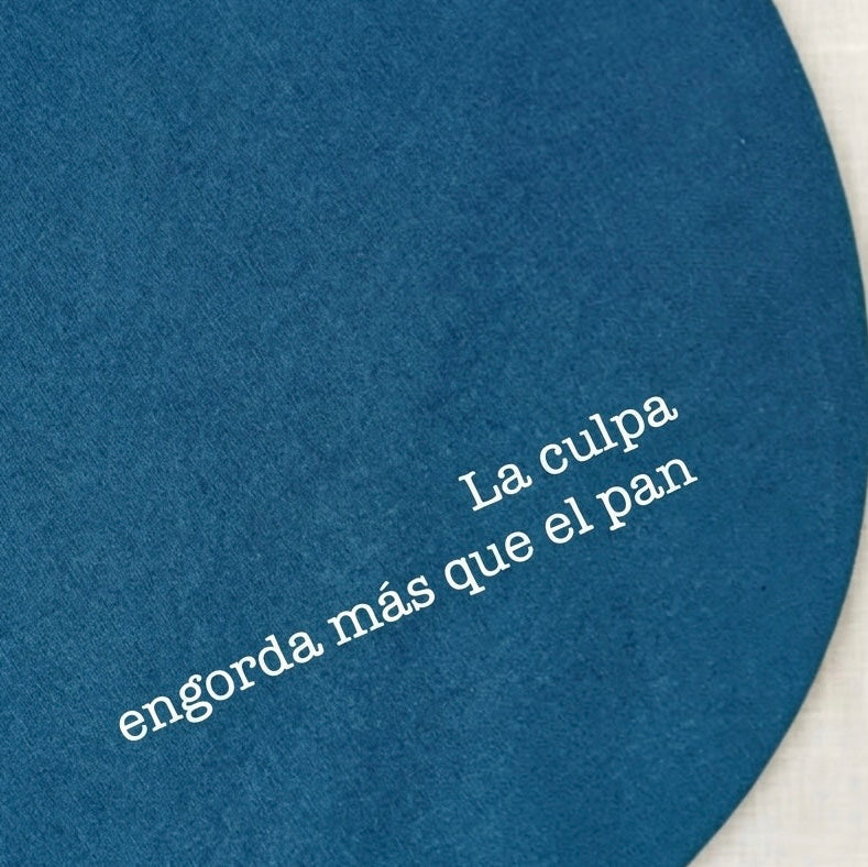 Mantel azul petroleo personalizado con frase reversible y con relleno