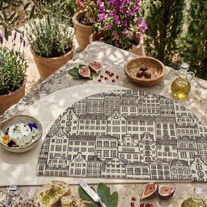 manteles de algodon 100% en forma de semicírculo reversible en tonos neutros sobre una mesa de un jardín mediterráneo